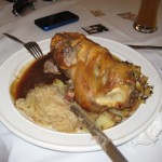Saritas meal; a pork knuckle with fried potatoes and Sauerkraut